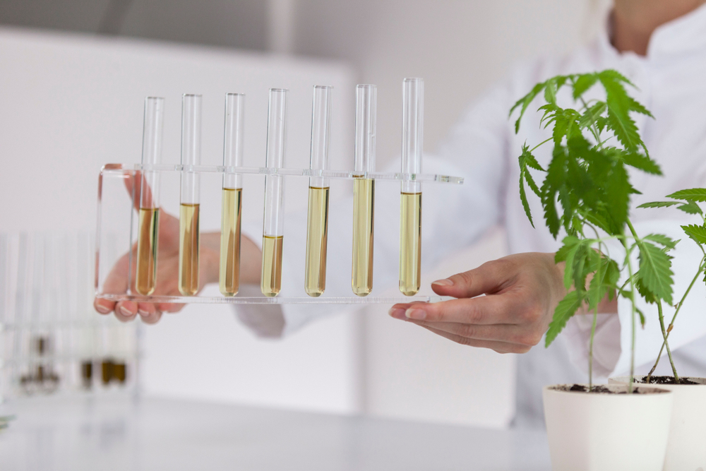 woman in lab tested CBD in vials